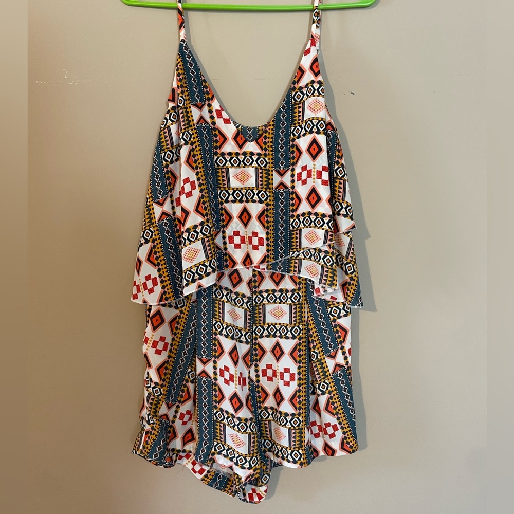 Multicolored, peep hole back romper.